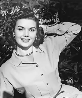 Young woman posing by blooming tree, (B&W), (Close-up), (Portrait)