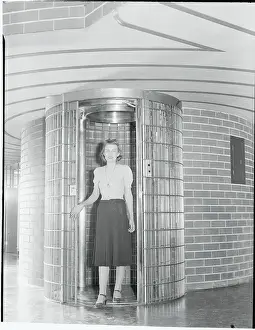 Young Woman Posing Inside Modern Elevator