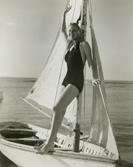Young woman posing on sailboat