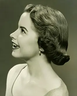 Wavy Hair Prints: Young woman posing in studio, (B&W), portrait