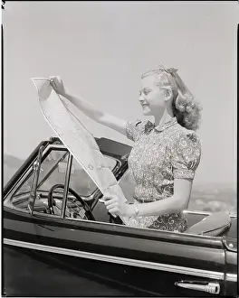 Young Woman Reading Road Map