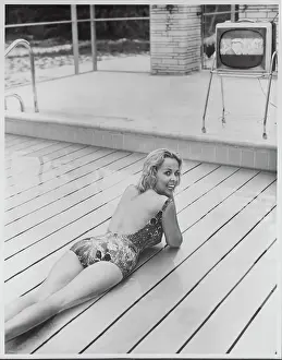 Progress Prints: Young Woman Relaxing on Swimming Pool Lift