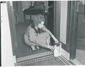 Front Door Prints: Young Woman Retrieving Her Protected Milk from Doorstep