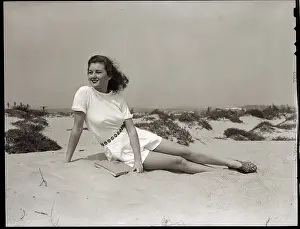 Young Woman Seated on the Beach