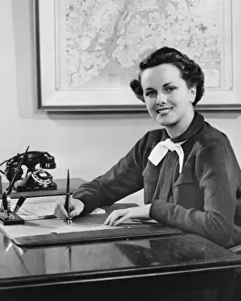 Fountain Pen Prints: Young woman sitting at desk, writing, (B&W)