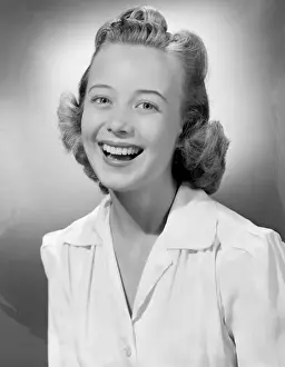Hair Back Prints: Young woman smiling, portrait