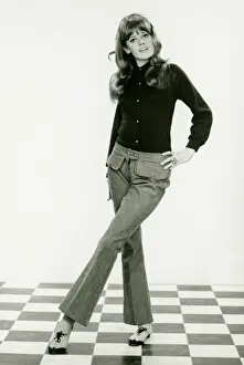 Flooring Prints: Young woman standing on checked floor, (B&W)