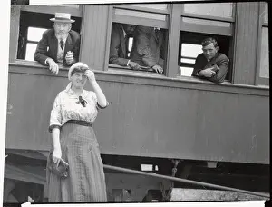 Young Woman Standing Near Train Window