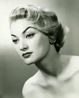 Earring Prints: Young woman with strong make-up, (B&W), close-up