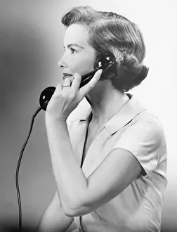 Short Sleeved Prints: Young woman using phone, posing in studio, (B&W), close-up