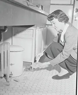 Deceit Prints: Young Woman Utilizing Rat Control with Bait