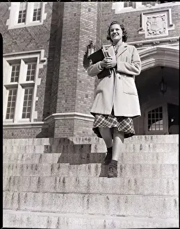 Young Woman Walking Down Steps