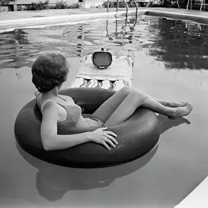 Huntington Prints: Young Woman Watches Television in the Pool