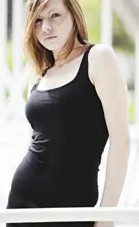 Reflective Prints: Young woman wearing a black tank top