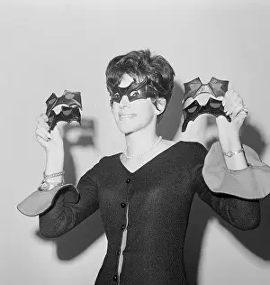 Young Woman Wearing and Displaying Batman Eyewear