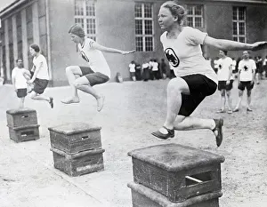 Hurdle Prints: Young Women Hurdling Over Low Obstacles