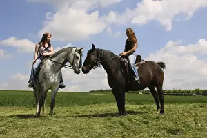 Riders Prints: Two young women riding on horseback, Bavaria, Germany, Europe