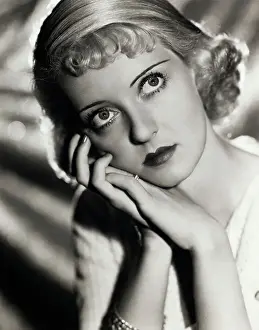 Younger Actress Bette Davis Posing With Her Hands to Cheek