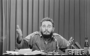 Younger Fidel Castro Gesturing While Speaking at Microphones