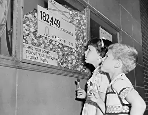 Jamaica Prints: Youngsters Gazing up at Inoculation Statistics Display in Hallway