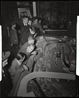 Youngsters Observing Electric Train Set