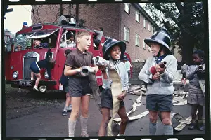 Youngsters Playing with Fire Hoses