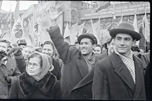 Youth Waving from Crowd