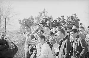 Youths Taunting Marchers with Confederate Flag
