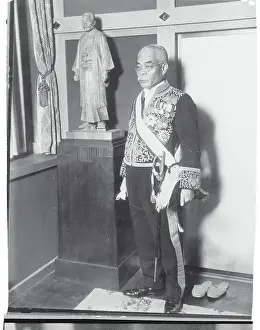 Yuko Hamaguchi Posing Besides Statue