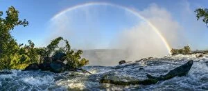 Images Dated 24th June 2014: The Zambezi River and rainbow just above The Eastern Cataract. Victoria Falls. Livingstone. Zambia
