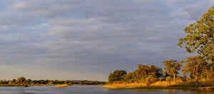 Images Dated 21st June 2014: Zambezi River view and small waterbuck (Kobus ellipsiprymnus) herd. Victoria Falls. Zambia