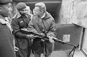 Zbigniew Brzezinksi Inspecting Gun