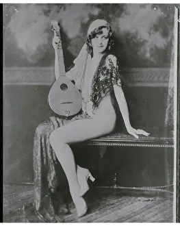 Ziegfield Dancer Madelyn Janice Courter Posing with Stringed Instrument
