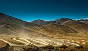 Zig zag road over mountain range